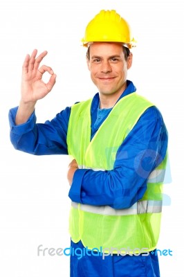 Smiling Builder Showing Thumb Up Stock Photo