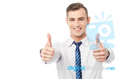 Smiling Business Executive With Thumbs Up Stock Photo