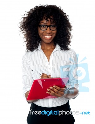 Smiling Business Lady Making Notes Stock Photo