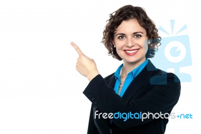 Smiling Business Professional Pointing Away Stock Photo