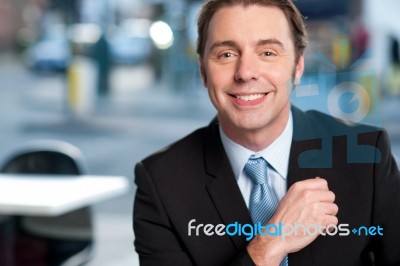 Smiling Businessman At Cafe Stock Photo