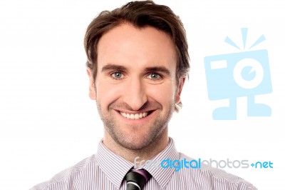 Smiling Businessman Looking At You Stock Photo