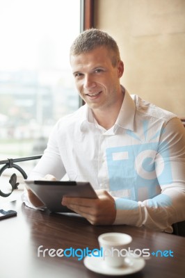 Smiling Businessman On Coffee Break In Restorant Stock Photo