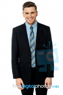 Smiling Businessman Posing Casually Stock Photo