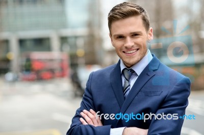 Smiling Businessman Posing For The Camera Stock Photo