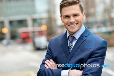 Smiling Businessman Posing For The Camera Stock Photo