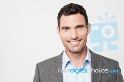 Smiling Businessman Posing To Camera Stock Photo