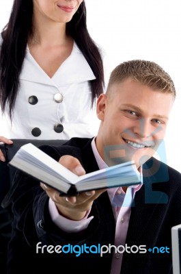 Smiling Businessman Showing Diary Stock Photo