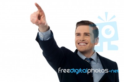 Smiling Businessman Showing Something Stock Photo