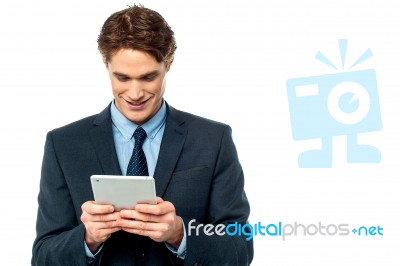 Smiling Businessman Using A Tablet Pc Stock Photo