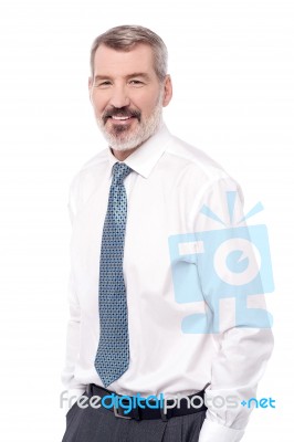 Smiling Businessman With Hands In Pocket Stock Photo