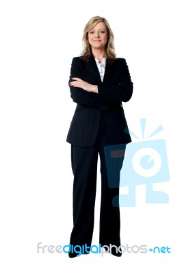 Smiling Businesswoman Arms Crossed Stock Photo