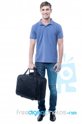 Smiling Casual Man Standing With Bag Stock Photo