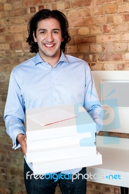 Smiling Caucasian Man Holding Pizza Boxes Stock Photo