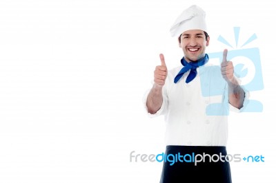 Smiling Chef Showing Double Thumbs Up Stock Photo