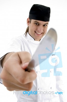 Smiling Chef Showing Knife Stock Photo