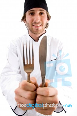 Smiling Chef Showing Knife And Fork Stock Photo