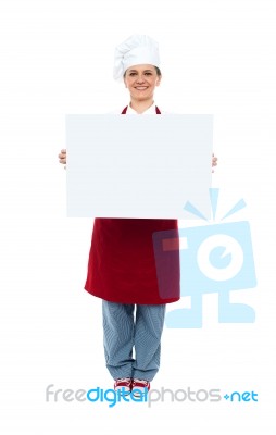 Smiling Chef Showing White Board Stock Photo