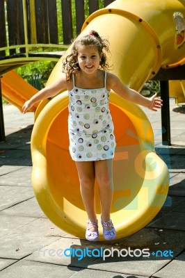 Smiling Child Jumping Stock Photo