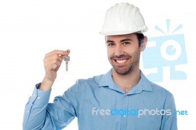 Smiling Civil Engineer Holding Key Stock Photo