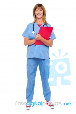 Smiling Confident Doctor Holding Clipboard Stock Photo