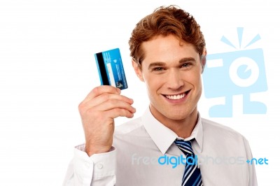 Smiling Corporate Guy Holding Credit Card Stock Photo