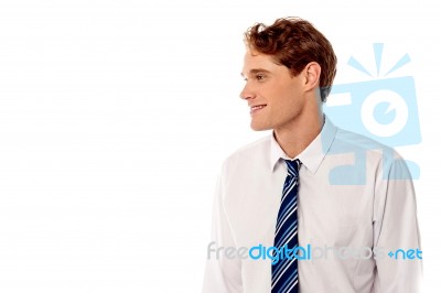 Smiling Corporate Guy Looking Away Stock Photo