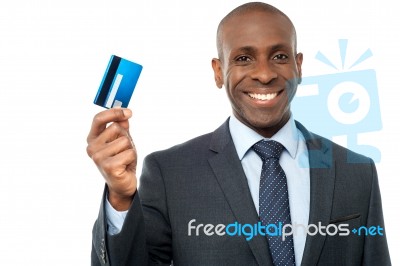 Smiling Corporate Guy Showing Credit Card Stock Photo