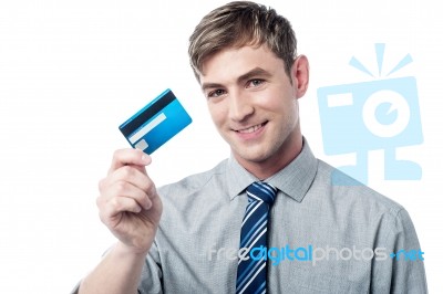 Smiling Corporate Guy Showing His Debit Card Stock Photo