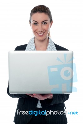 Smiling Corporate Lady Holding Brand New Laptop Stock Photo