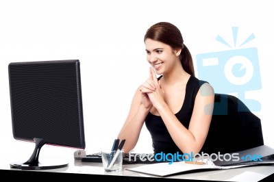 Smiling Corporate Lady In Her Office Stock Photo