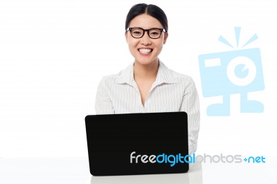 Smiling Corporate Lady With Laptop Stock Photo