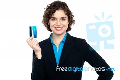 Smiling Corporate Woman Holding Credit Card Stock Photo