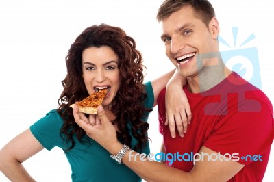 Smiling Couple Eating Pizza Stock Photo