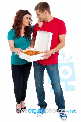 Smiling Couple Holding Pizza Box Stock Photo