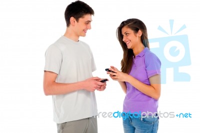 Smiling Couple Holding Smartphone Stock Photo