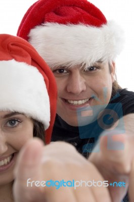 Smiling Couple Pointing Forward Stock Photo