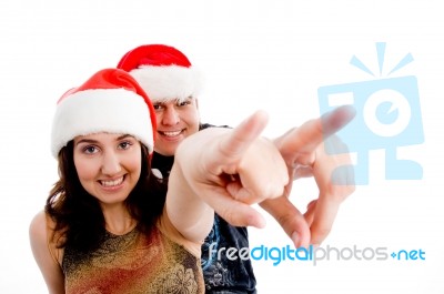 Smiling Couple Pointing Forward Stock Photo