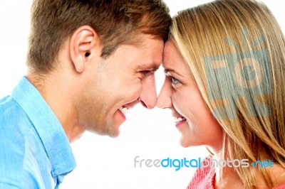 Smiling Couple Posing. Foreheads Touching Stock Photo