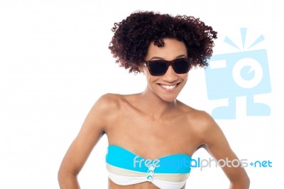 Smiling Curly Haired Bikini Model In Dark Shades Stock Photo