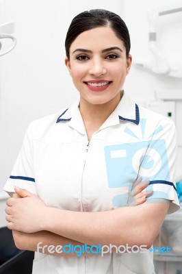 Smiling Dentist Posing Confidently Stock Photo