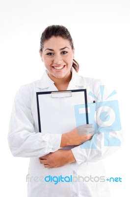 Smiling Doctor Holding Writing Pad Stock Photo