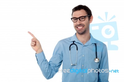 Smiling Doctor Pointing Copy Space Area Stock Photo