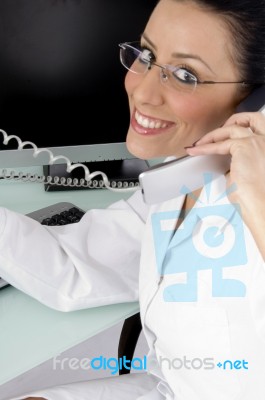 Smiling Doctor Talking On Phone Stock Photo