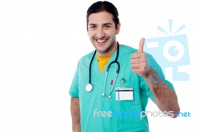 Smiling Doctor With Okay Gesture Stock Photo