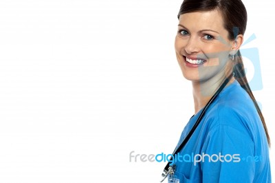 Smiling Doctor With Stethoscope Around Her Neck Stock Photo