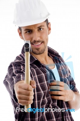 Smiling Engineer Showing Hammer Stock Photo