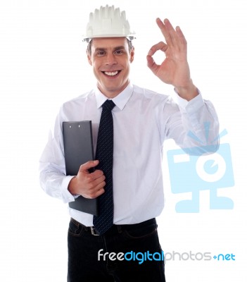 Smiling Engineer Showing Ok Gesture Stock Photo