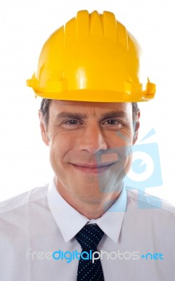 Smiling Engineer Wearing Helmet Stock Photo