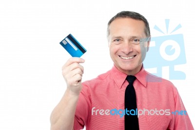 Smiling Executive Showing Debit Card Stock Photo